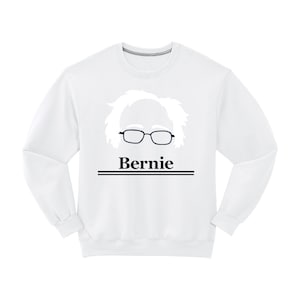 May include: White sweatshirt with a black and white silhouette of Bernie Sanders' face and the word "Bernie" printed on the front.