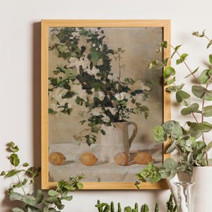 Vintage flowers and lemons art print reproduction featuring a classic floral citrus still life composition. The artwork shows delicate flowers paired with bright lemons in a timeless arrangement, rendered in soft natural tones with traditional painterly detail. This vintage still life wall art is ideal for kitchen decor, dining rooms, and elegant homes inspired by European, Mediterranean, or classic farmhouse style.