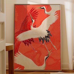 Red and white Japanese cranes in flight illustrated in a traditional Asian art style on a vibrant red background. Framed wall art.