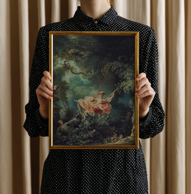 Woman holding Fragonard The Swing giclée art print in gold float frame, size reference scale photo, Jean-Honoré Fragonard 1767 French Rococo painting reproduction, romantic classical art gift for art history lover