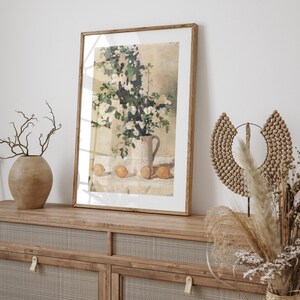 Floral and lemon still life wall art print displayed as vintage home decor. This reproduction features flowers and lemons arranged in a balanced classic composition with warm tones and refined detail, making it perfect for kitchens, breakfast nooks, gallery walls, or traditional interiors seeking timeless botanical artwork.