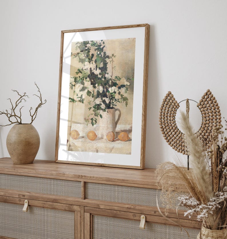 Floral and lemon still life wall art print displayed as vintage home decor. This reproduction features flowers and lemons arranged in a balanced classic composition with warm tones and refined detail, making it perfect for kitchens, breakfast nooks, gallery walls, or traditional interiors seeking timeless botanical artwork.