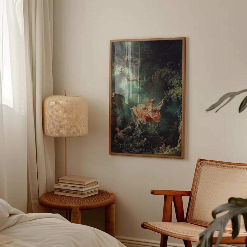 Fragonard The Swing L'Escarpolette 1767 French Rococo art print, natural oak wood float frame, hung on cream wall above white linen bed, wicker rattan table lamp cane armchair, romantic chateaucore bedroom wall decor