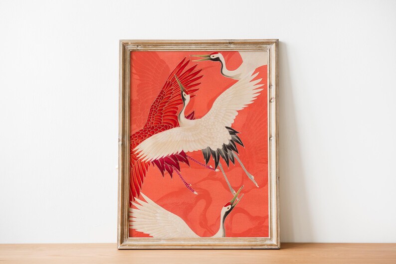 Red and white Japanese cranes in flight illustrated in a traditional Asian art style on a vibrant red background. Framed or unframed wall art.