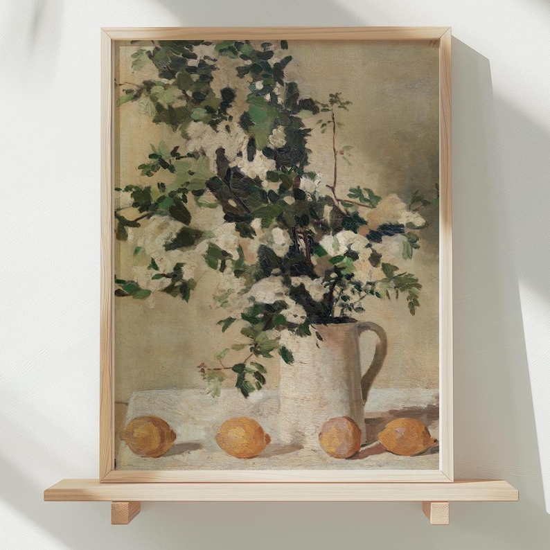 Floral and lemon still life wall art print displayed as vintage home decor. This reproduction features flowers and lemons arranged in a balanced classic composition with warm tones and refined detail, making it perfect for kitchens, breakfast nooks, gallery walls, or traditional interiors seeking timeless botanical artwork.