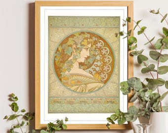May include: A framed art print featuring a profile illustration of a person adorned with ivy leaves in their hair. The circular design is set against a warm ochre background with decorative floral patterns and a light green ivy border.