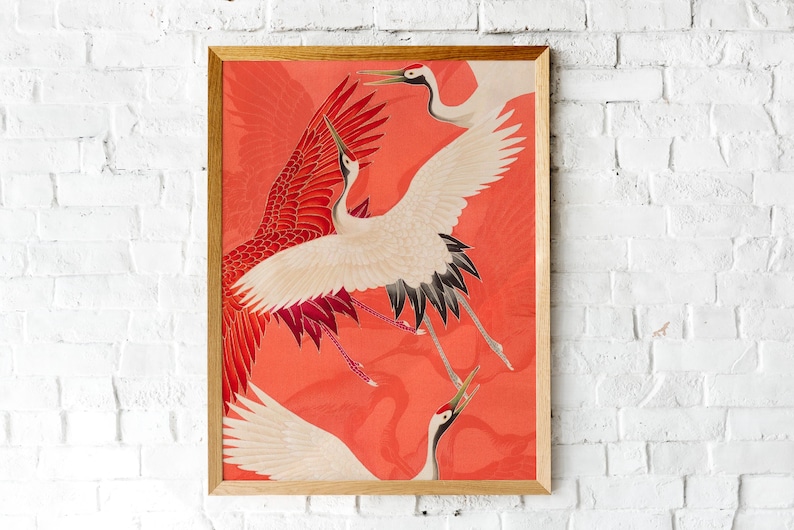 Red and white Japanese cranes in flight illustrated in a traditional Asian art style on a vibrant red background. Framed or unframed wall art.