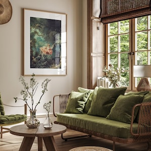Fragonard The Swing L'Escarpolette French Rococo painting giclée print, natural oak wood frame white mat, hung on beige wall above olive green velvet rattan sofa wicker armchair, bamboo roman blind large French window white blossom, romantic cottagecore nature lover living room wall art