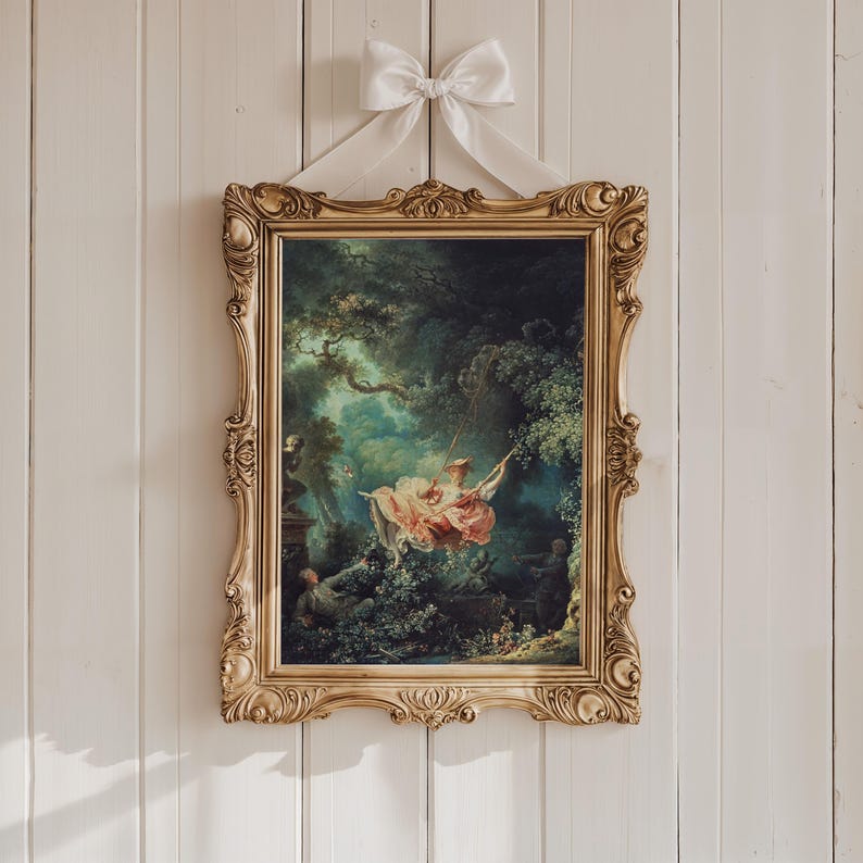 Fragonard The Swing L'Escarpolette 1767 French Rococo painting giclée print, ornate carved gold baroque Louis XVI style frame, white satin ribbon bow hanger, cream painted shiplap wood wall, Marie Antoinette coquette aesthetic chateaucore shabby chic romantic wall art gift for her