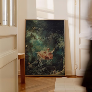 Fragonard The Swing Jean-Honoré Fragonard 1767 Rococo masterpiece large giclée print, natural oak wood float frame, leaning on herringbone parquet floor against white Haussmann moulded panelled door, French apartment chateaucore romantic wall art