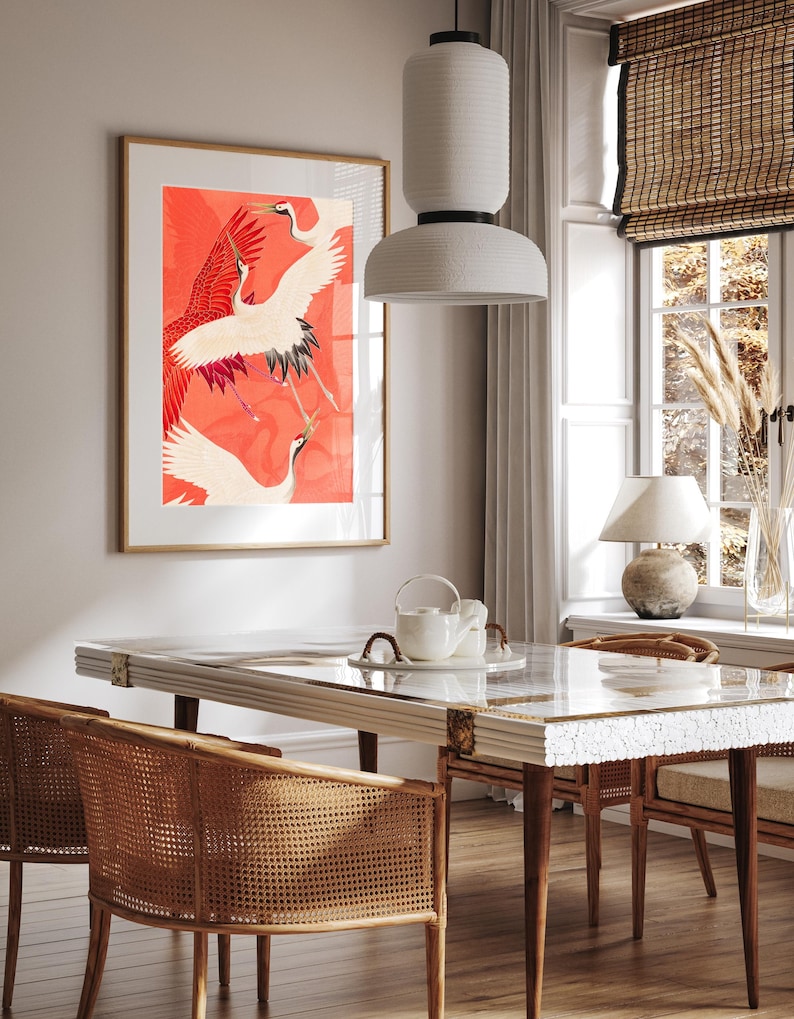 Red and white Japanese cranes in flight illustrated in a traditional Asian art style on a vibrant red background. Framed or unframed wall art.