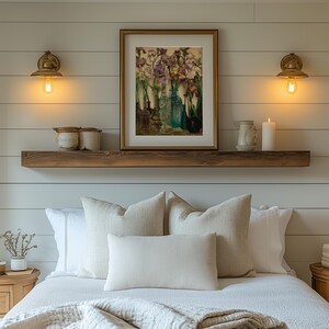 ramed vintage flower wall art print displayed in a cozy interior setting, reproduced from Frederick Judd Waugh’s 1922 Rum Row floral still life. The botanical artwork features classic early twentieth-century style with natural colors and refined detail, ideal for cottagecore, traditional, or antique-inspired home decor.