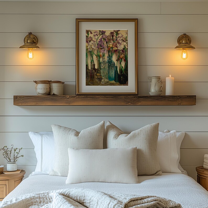 ramed vintage flower wall art print displayed in a cozy interior setting, reproduced from Frederick Judd Waugh’s 1922 Rum Row floral still life. The botanical artwork features classic early twentieth-century style with natural colors and refined detail, ideal for cottagecore, traditional, or antique-inspired home decor.