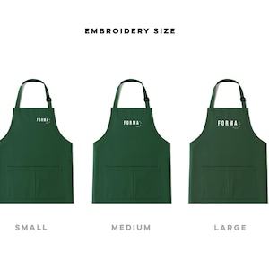 May include: Three dark green aprons with neck straps and two front pockets, labelled small, medium, and large. Each apron features the white text FORMA with a small circular icon. The top text reads EMBROIDERY SIZE, indicating the scale of the logo.