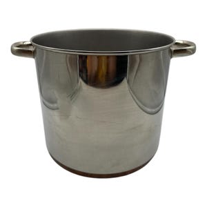 May include: A silver stainless steel pot with copper accents and two handles. The pot is empty and has a reflective surface.