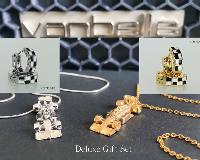 May include: A deluxe gift set featuring silver and gold-toned race car pendant necklaces, and matching hoop earrings with black and white checkered enamel. The text "Deluxe Gift Set" is visible.