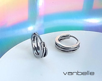 High polish Stainless non symmetrical ring hoop earrings