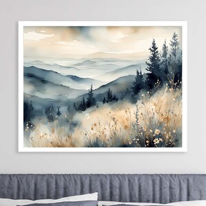 May include: A watercolor painting of a mountain landscape with a misty background. The painting features a row of trees in the foreground and a range of mountains in the distance. The colors are muted and soft, with shades of blue, gray, and brown.