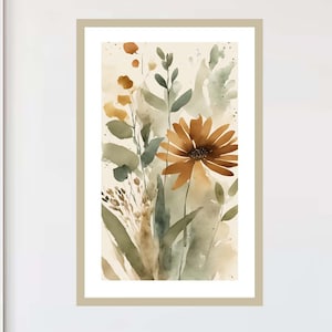 May include: Watercolor painting of a floral arrangement in a beige frame. The artwork features a large, brown daisy-like flower with green leaves and stems. The background is a soft, neutral color, creating a serene and natural aesthetic.