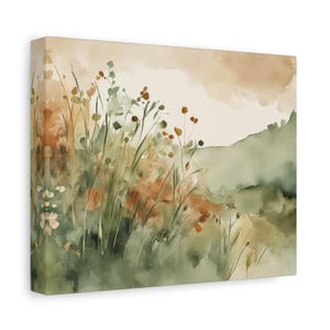May include: Watercolor canvas art print featuring a field of tall grass and wildflowers in shades of green, orange, and beige. The artwork depicts a serene landscape with a soft, blurred background, evoking a sense of tranquility and nature.