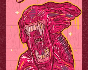 May include: A rectangular graphic print on a pink background featuring a fuchsia alien creature with an open mouth, sharp teeth, and visible saliva. The text "You Should" appears at the top and "Smile More" at the bottom in dark red script.