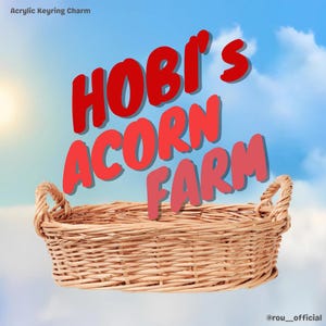 May include: A woven wicker basket with two handles, set against a blue sky background. The text "HOBI'S ACORN FARM" is displayed in red and pink lettering above the basket. The words "Acrylic Keyring Charm" are in the top left corner.