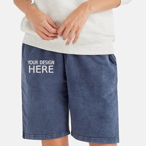 May include: A pair of dark blue cotton shorts with a white embroidered design that says "YOUR DESIGN HERE".