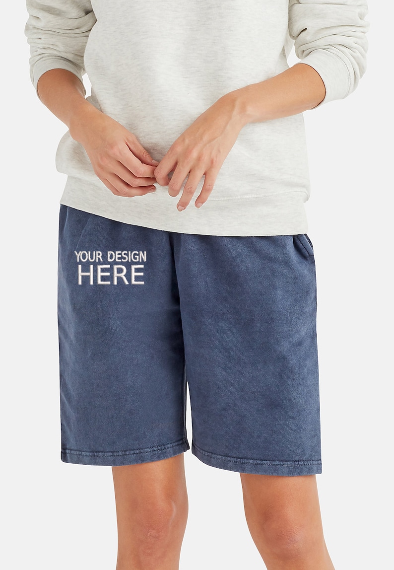 May include: A pair of dark blue cotton shorts with a white embroidered design that says "YOUR DESIGN HERE".