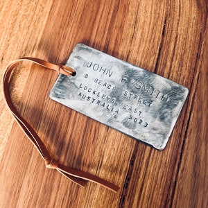 Personalised steel luggage tag with country stamps
