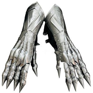 May include: Two silver metal gauntlets with articulated fingers and claw-like tips. The armour has engraved details and is designed to protect the hands and forearms. The Battle Queen Armory logo is in the upper left corner.