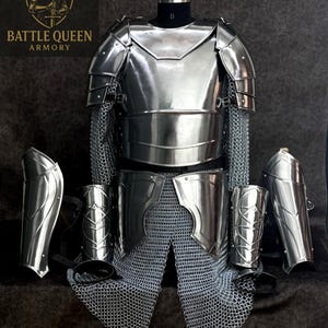 May include: A full set of polished steel armor, including a breastplate, shoulder guards, arm guards, and leg protection, displayed on a mannequin. Chainmail is integrated into the design. The logo "BATTLE QUEEN ARMORY" is visible.