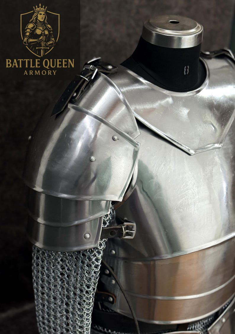 May include: Polished steel armor, featuring articulated shoulder plates and a chest piece. The armor includes chainmail and leather straps. The "Battle Queen Armory" logo is visible in the upper left corner.