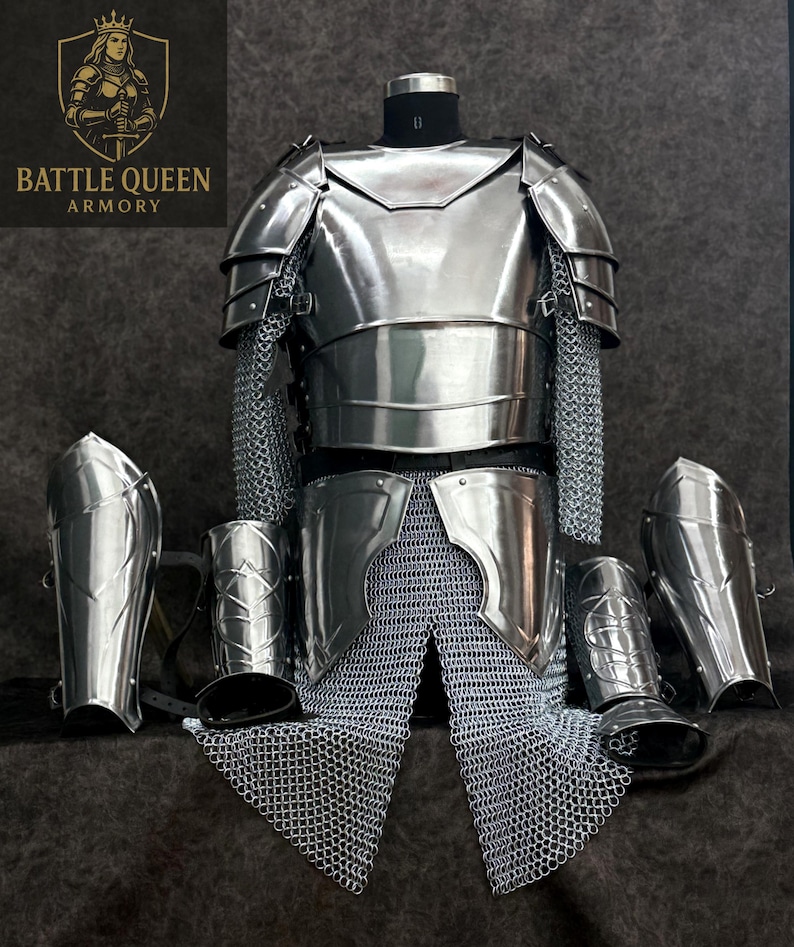 May include: A full set of polished steel armor, including a breastplate, shoulder guards, and leg protection, displayed on a mannequin. Chainmail is integrated into the design. The Battle Queen Armory logo is visible in the upper left corner.