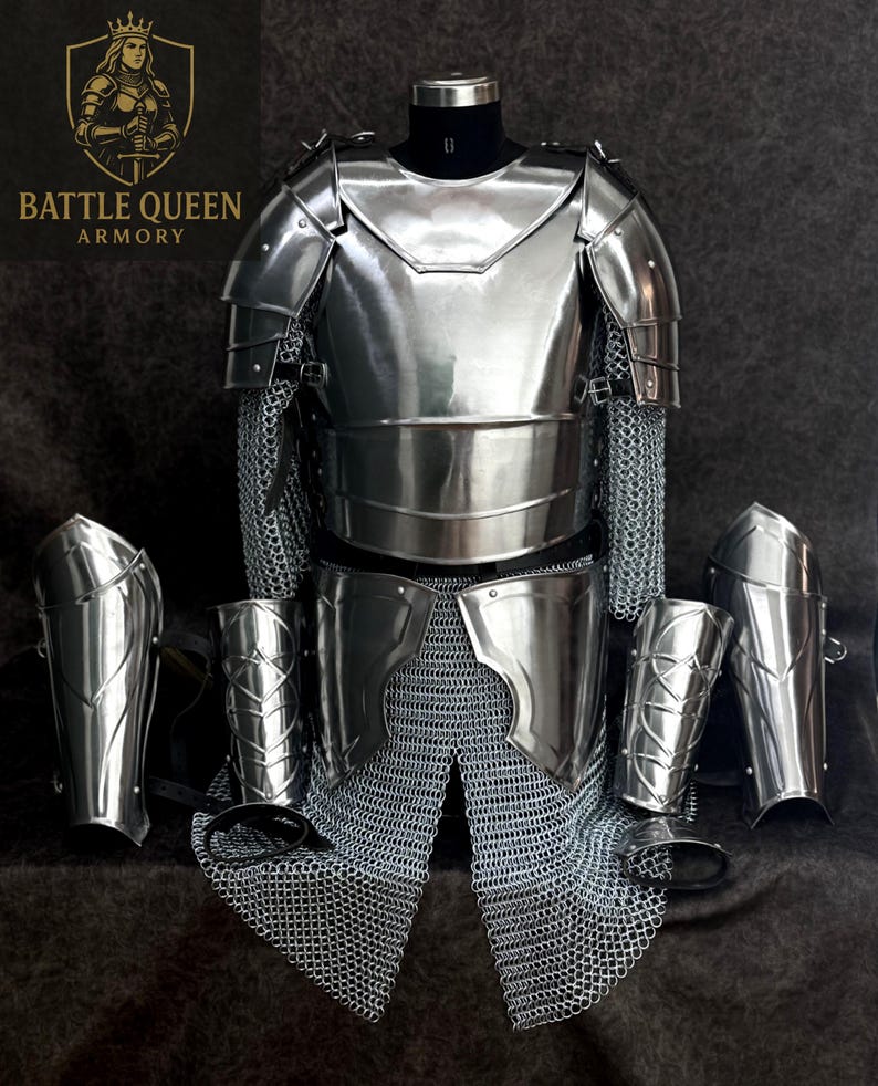 May include: A full set of polished steel armor, including a breastplate, chainmail, and arm guards. The armor is displayed on a mannequin, with the Battle Queen Armory logo visible in the upper left corner.