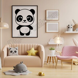 May include: A black and white illustration of a panda bear with large eyes and a smiling face. The illustration is framed and hanging on a wall in a nursery or child's room.