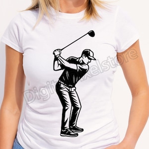 May include: White t-shirt featuring a black and white illustration of a golfer in mid-swing. The graphic depicts a golfer wearing a cap, shirt, pants, and shoes, with a golf club raised above their head. The design is a simple, bold graphic.