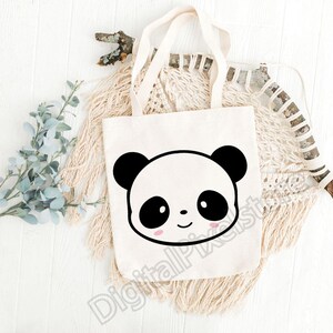 May include: A white tote bag featuring a black and white panda face design. The panda has black eyes, a black nose, and pink cheeks.