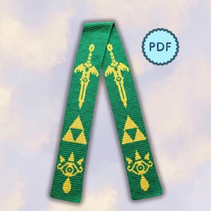 May include: A green knitted scarf featuring a repeating yellow pattern of swords, triangular emblems, and eye-shaped symbols. The scarf is displayed in a V-shape, and a circular blue badge with the text PDF is positioned in the upper right corner.