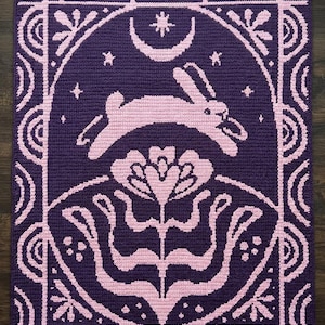 May include: A white ceramic mug with a black handle and the text "But First, Coffee" in a bold, black font. The mug is set against a neutral background, highlighting its simple design.