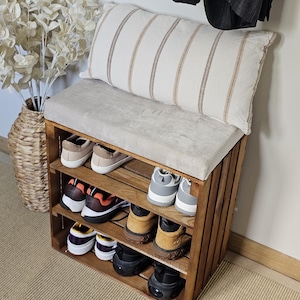 Hallway shoe bench with cushion and wooden crate storage underneath