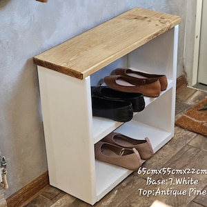 May include: White shoe rack with a wooden top. The rack has two shelves and is 65cm x 55cm x 22cm. The base is white and the top is antique pine.