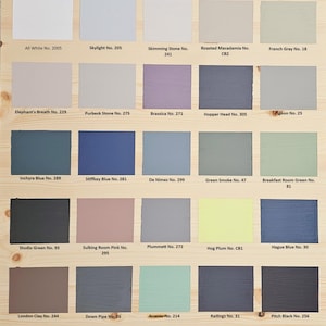 May include: A color chart with 18 paint color samples, each with a name and number. The colors range from white to black, with shades of gray, blue, green, pink, and brown.