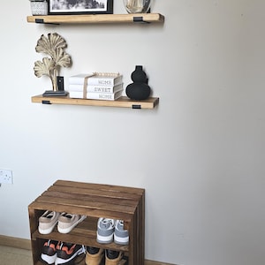 Wooden crate shoe rack showing sturdy construction and fixed shelves