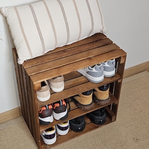Solid pine slatted wood detail on rustic 3-tier wooden crate shoe storage unit.