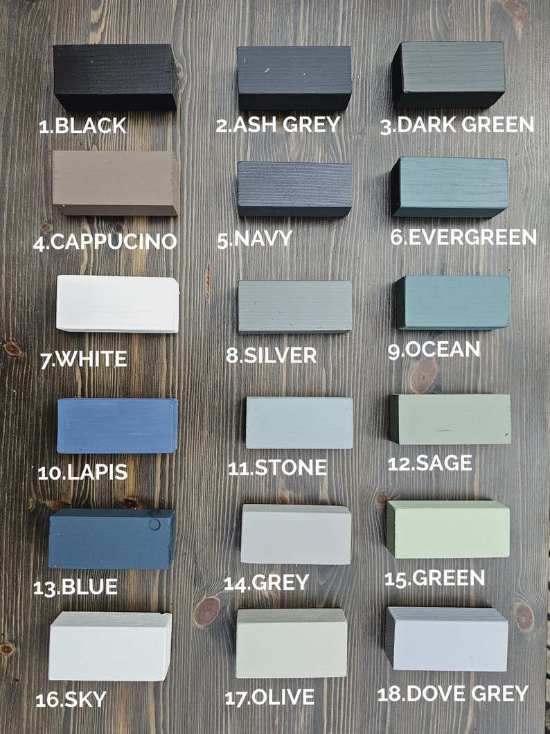 May include: A wooden color palette featuring 18 painted blocks in various shades. Colors include black, ash grey, dark green, cappuccino, navy, evergreen, white, silver, ocean, lapis, stone, sage, blue, grey, green, sky, olive, and dove grey.