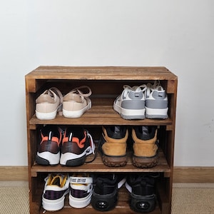 Rustic wooden shoe rack and storage bench used in hallway for shoes, boots, and home organisation – handcrafted solid wood furniture.