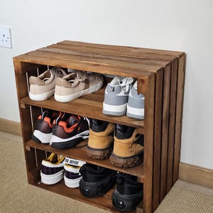 Wooden shoe rack bench with optional upholstered cushion in hallway setting