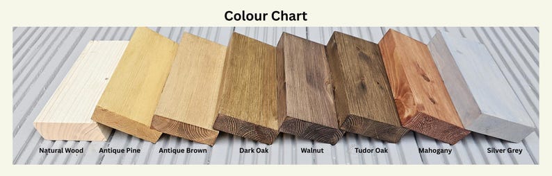 May include: A color chart displaying eight wooden planks in various finishes. The finishes include Natural Wood, Antique Pine, Antique Brown, Dark Oak, Walnut, Tudor Oak, Mahogany, and Silver Grey. The text "Colour Chart" is at the top.