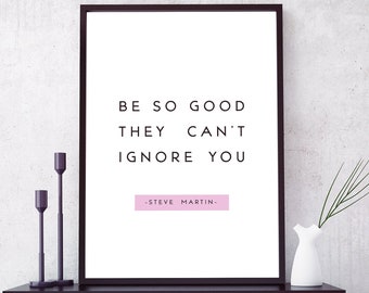 May include: A black framed motivational poster with the quote "Be so good they can't ignore you -Steve Martin-." The poster is hanging on a wall above a red bookshelf with black accents. The bookshelf is filled with books, a clock, and decorative items.