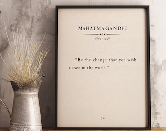 May include: Black framed print with a white background and black text. The text reads "Mahatma Gandhi 1869-1948" and "Be the change that you wish to see in the world."